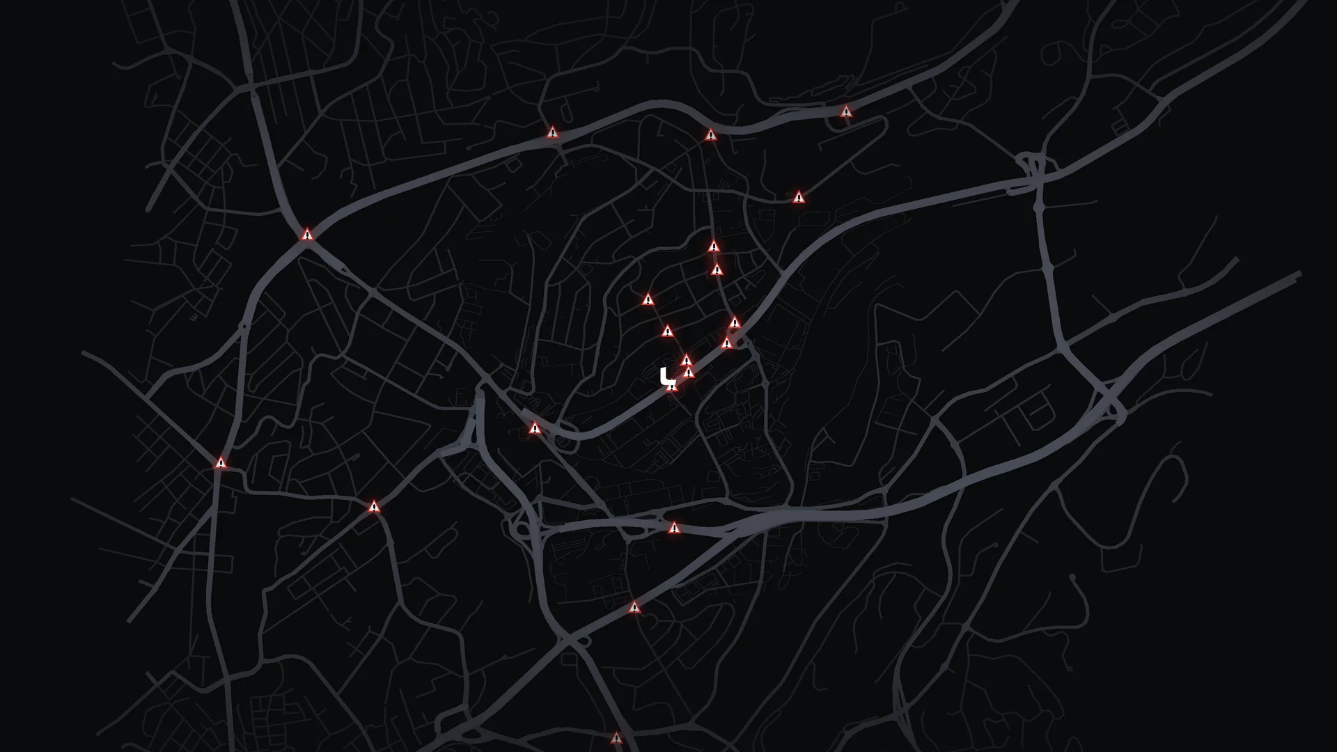 A dark map around Risløkka test centre with 21 danger spots marked by red warning triangles.
